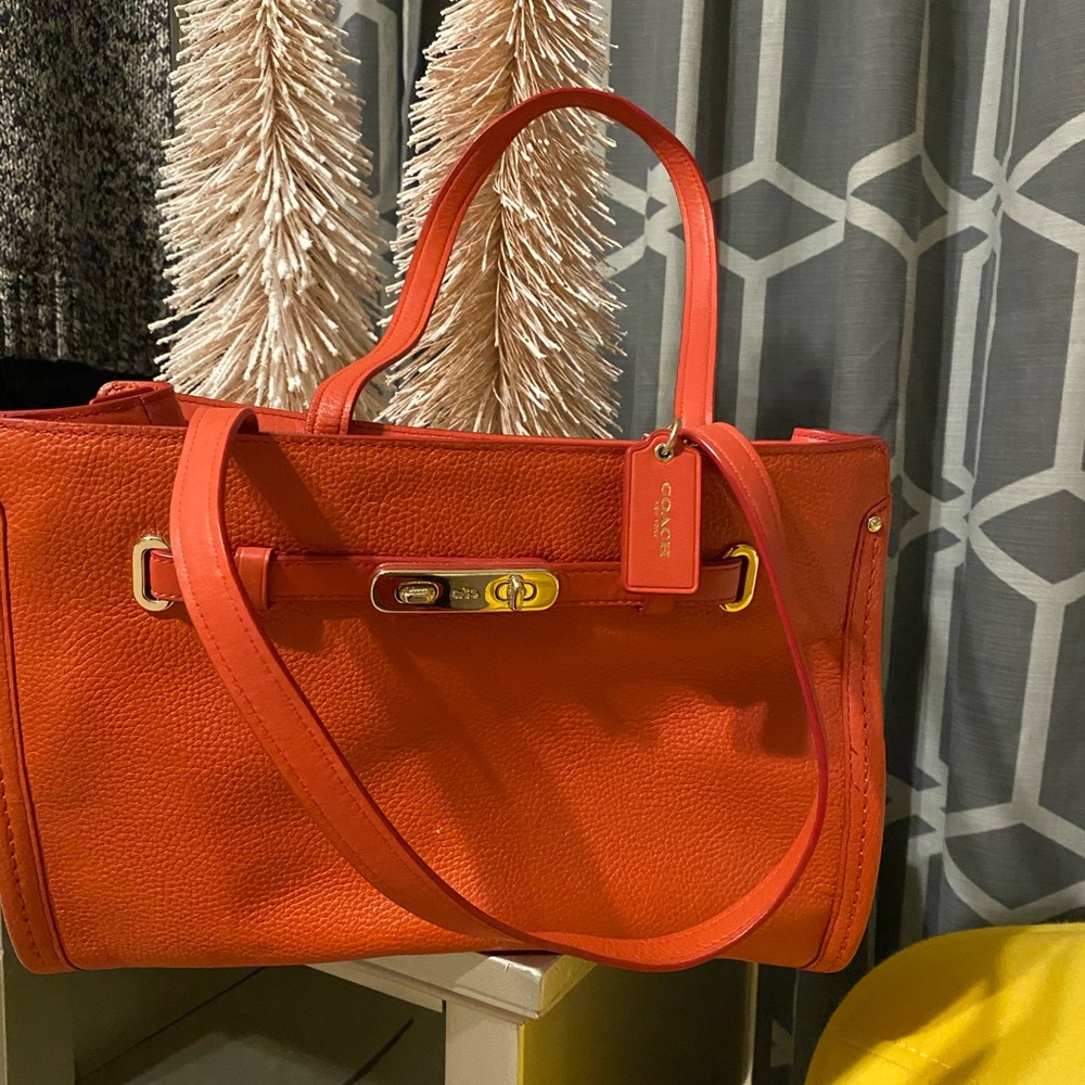 Beautiful orange Coach handbag.